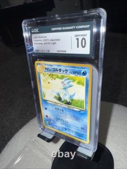 Light Gold Duck Pokémon 2001 Japanese Darkness, And Two Light CGC 10