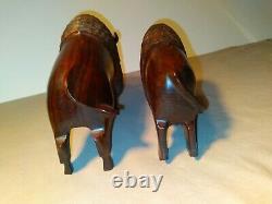 Set of two (2) carved wooden Ironwood buffalo adult and youth sculpture