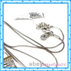 Ensemble de boucles d'oreilles créoles et de collier long à deux tons avec franges de tapisserie de Brighton, 180 $ avec pochette