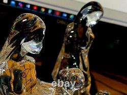Ensemble de deux belles figurines en verre taillé en cristal représentant une dame avec un enfant fabriquées en Italie.