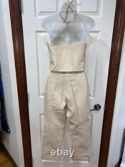 Ensemble haut à col halter en cuir crème et pantalon taille haute de la collection Hugo Buscati pour femmes