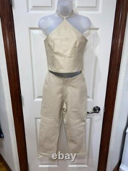Ensemble haut à col halter en cuir crème et pantalon taille haute de la collection Hugo Buscati pour femmes