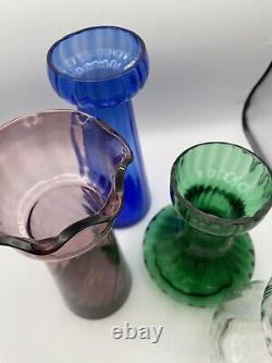 Vases en verre vintage pour forcer les bulbes de jacinthes violets, bleus, verts et transparents